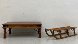 A vintage Anglo-Indian fruitwood coffee table having a rectangular thumb moulded top with and iron