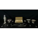 A mixed collection of gold and silver plated fruit spoons, fish servers, cocktail forks and a shaker