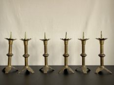 A set of six gothic inspired brass pricket candlesticks. H.36cm