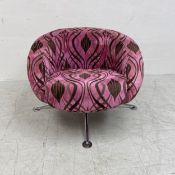 A retro styled swivel tub armchair on aluminium base. W.80 H.66cm
