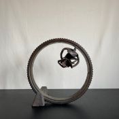 A bronze sculpture in the scrap metal art style, signed A C to base. H.43cm