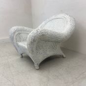 A voluminous vintage wicker conservatory armchair. D.110cm