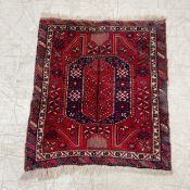 A hand knotted Persian style Khamseh rug having a central lozenge medallion surrounded by stylised