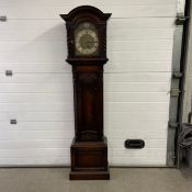 A mid century oak cased longcase clock with Westminster chime brass and silvered dial. H.191cm