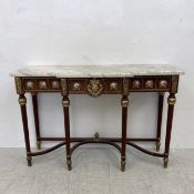 A contemporary Louis XVI style console table having a break front marble top over a gilt metal