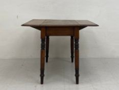 A 19th century mahogany drop-leaf Pembroke table having a square thumb-moulded top raised on four