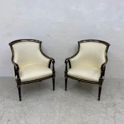 A pair of contemporary Louis XVI style armchairs each having a shaped gilt and lacquered back and
