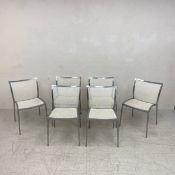 A set of six Zanotta aluminium framed dining chairs with mesh back and seats and maker's stamp to
