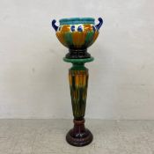 A vintage ceramic majolica jardinier in two parts having a Neoclassical twin handled semi lobed