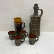 A collection of mid-century ceramics to include a West German style pitcher with four matching