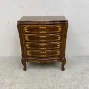A contemporary walnut chest of serpentine fronted drawers in the French 19th century style having