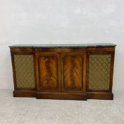 A contemporary Regency style credenza or side cabinet having a breakfront green marble top over a