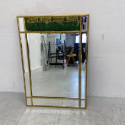 A contemporary wall mirror having a painted grape and vine moulded frieze over a faux aged