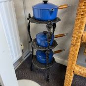 A set of three enamelled cast iron Le Creuset saucepans with wooden handles along with a vintage