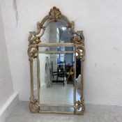 A contemporary 19th century style mirror having a shaped pediment with gilt shell cresting over an