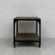 A Decker industrial style metal framed side or lamp table by Anthropologie UK on casters. H.64 W.