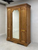 A late 19th century Aesthetic style birch compactum wardrobe in four parts having a moulded