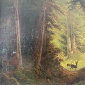 A 20th century oil on board depicting deer in a woodland setting in a painted ebonised frame.