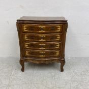 A contemporary walnut chest of serpentine fronted drawers in the French 19th century style having