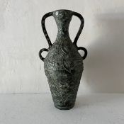 A large vintage twin handled ceramic amphora of baluster form with heavily textured abstract