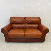 A vintage Italian tan leather two seater sofa by Sofitalia with a maker's plaque. W.175 D.90cm