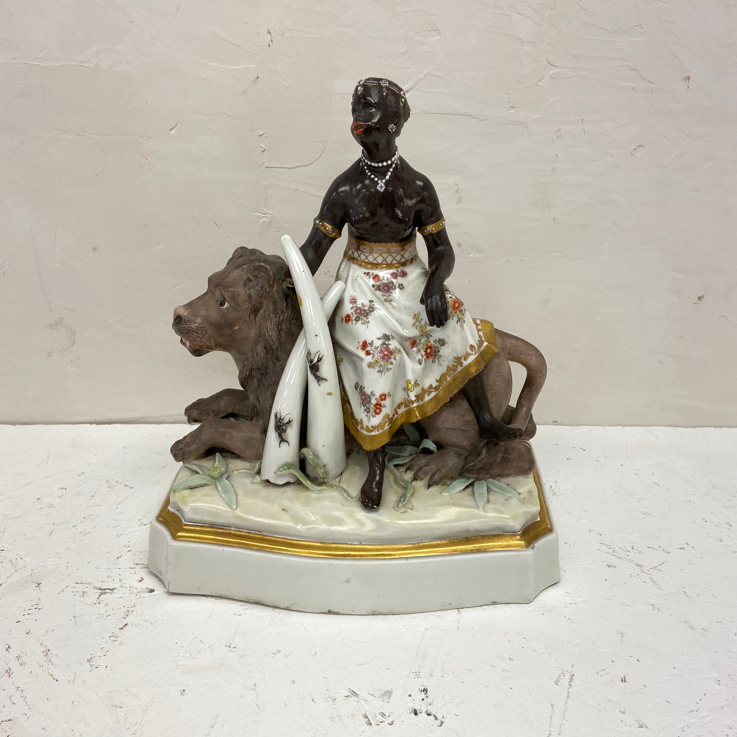 An 18th century hand painted European porcelain allegory of Africa depicting a blackamoor figure on - Image 4 of 7