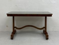 A William IV rosewood side or library centre table having a rectangular top fitted with a piece of