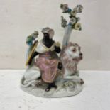 A possibly 18th century hand painted European porcelain allegory of Africa depicting a blackamoor