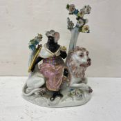 A possibly 18th century hand painted European porcelain allegory of Africa depicting a blackamoor