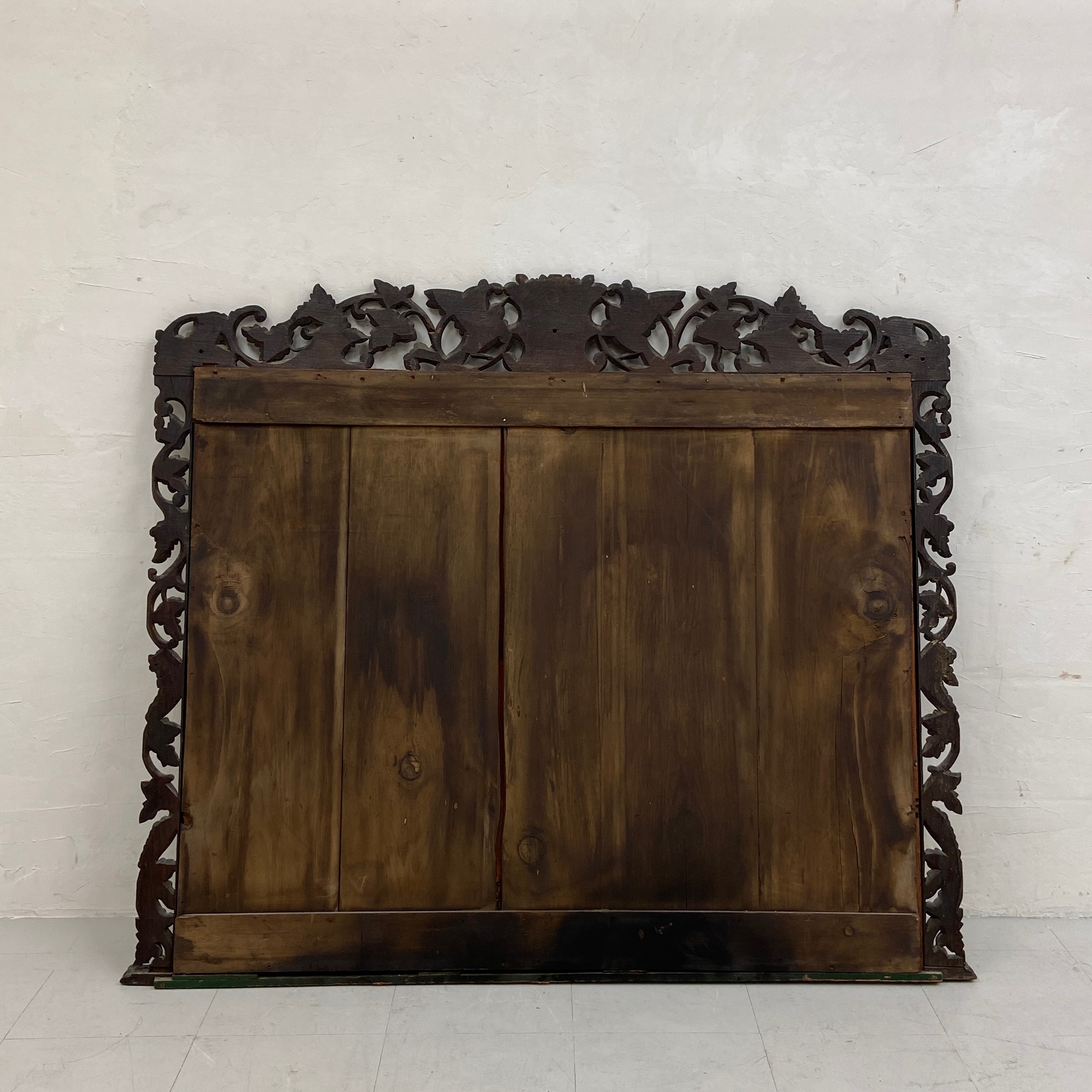 A large 19th century overmantle mirror having a rectangular plate in an ornately carved Baroque - Image 4 of 4