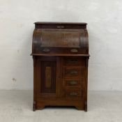 A late 19th century walnut cylinder bureau writing desk in two parts having a single frieze drawer