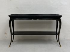 A 20th century Louis XV style console or side table possibly by Maison Jansen having a black