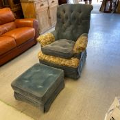 A Victorian style armchair with a scrolled button back and arms over a cushioned seat upholstered in