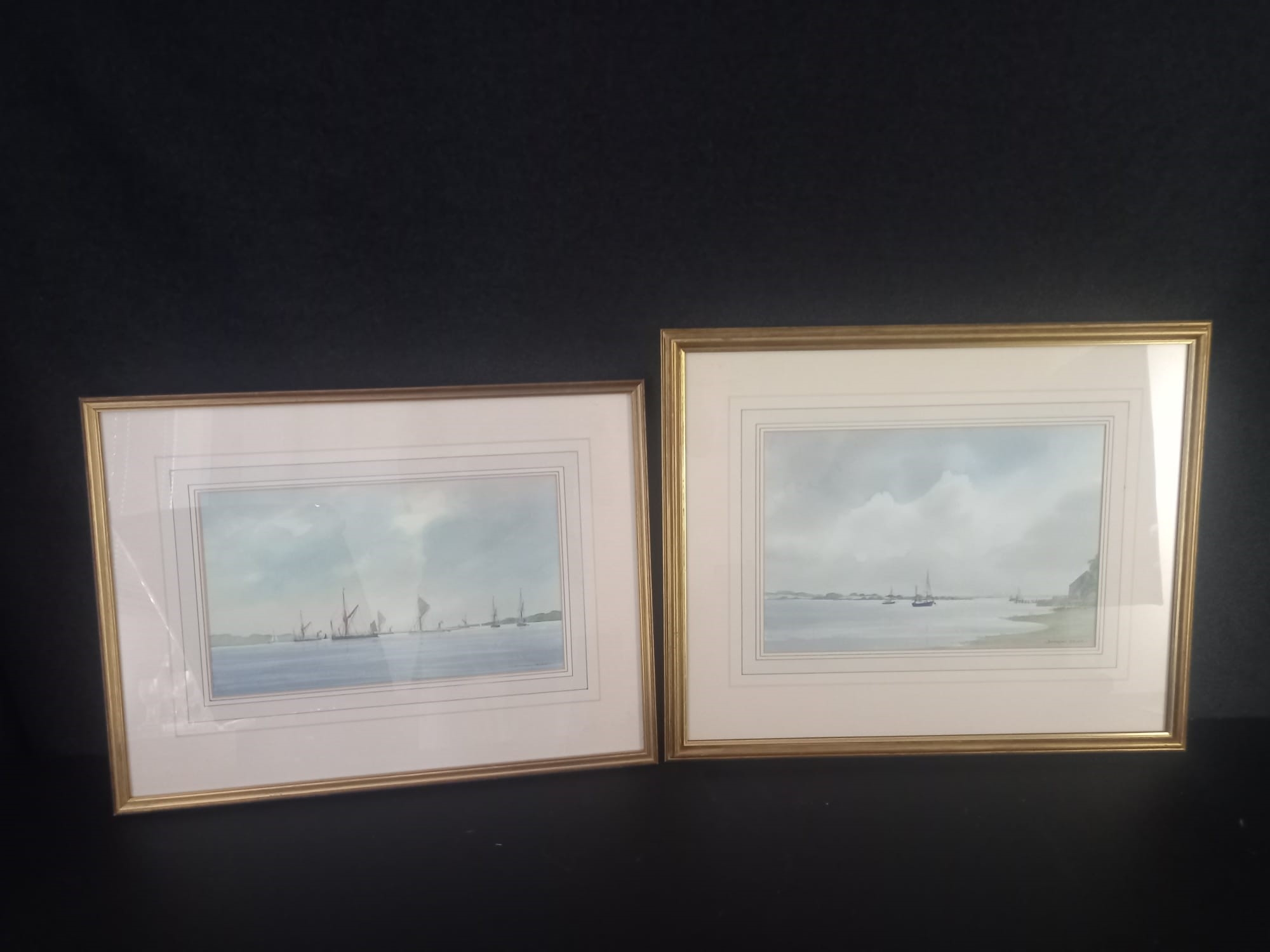 A pair of framed and glazed watercolours, sailing boats at sea, signed Anthony Osler, with gallery