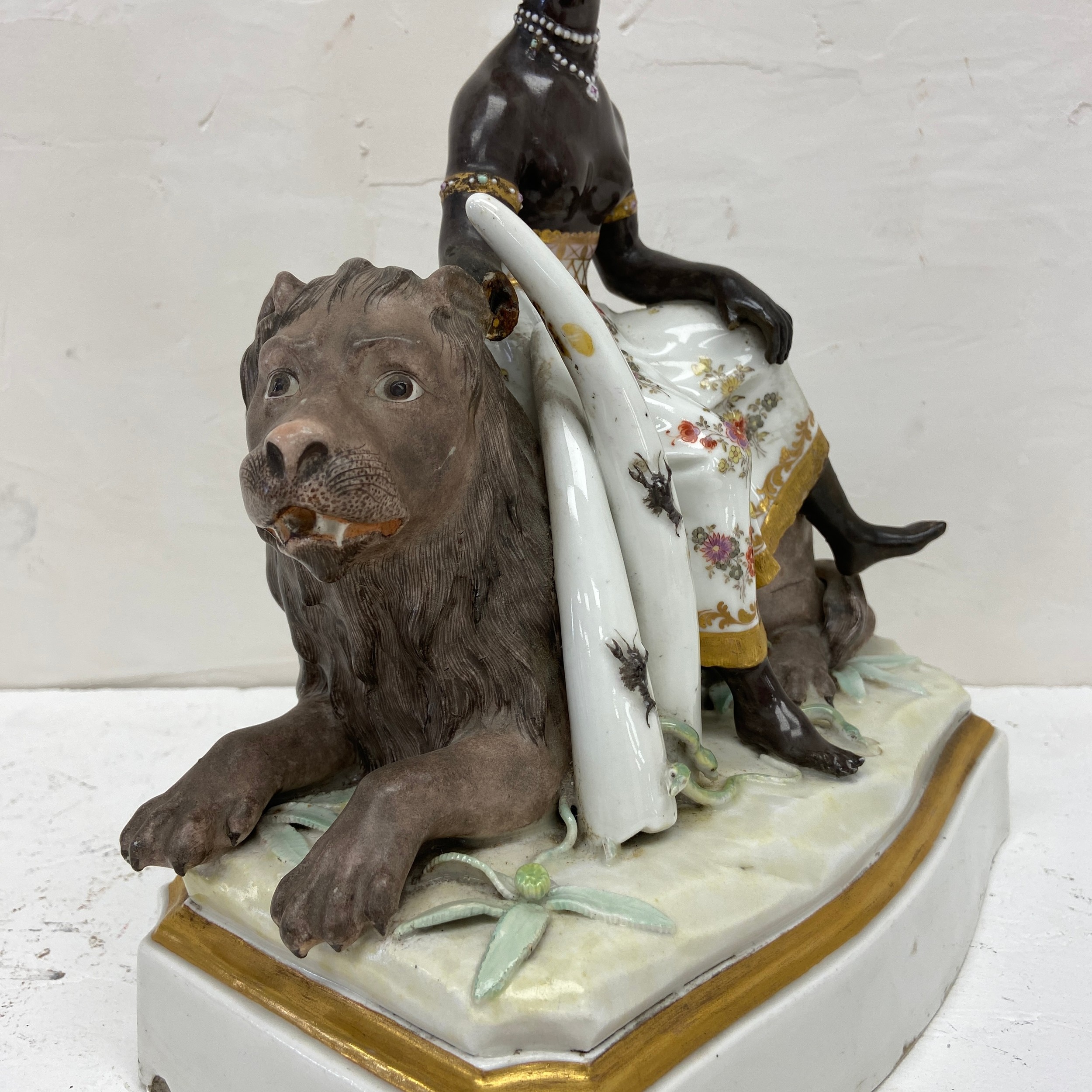 An 18th century hand painted European porcelain allegory of Africa depicting a blackamoor figure on - Image 6 of 7