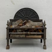 A 19th century Regency style steel fire grate. H.65 W.60 D.28cm