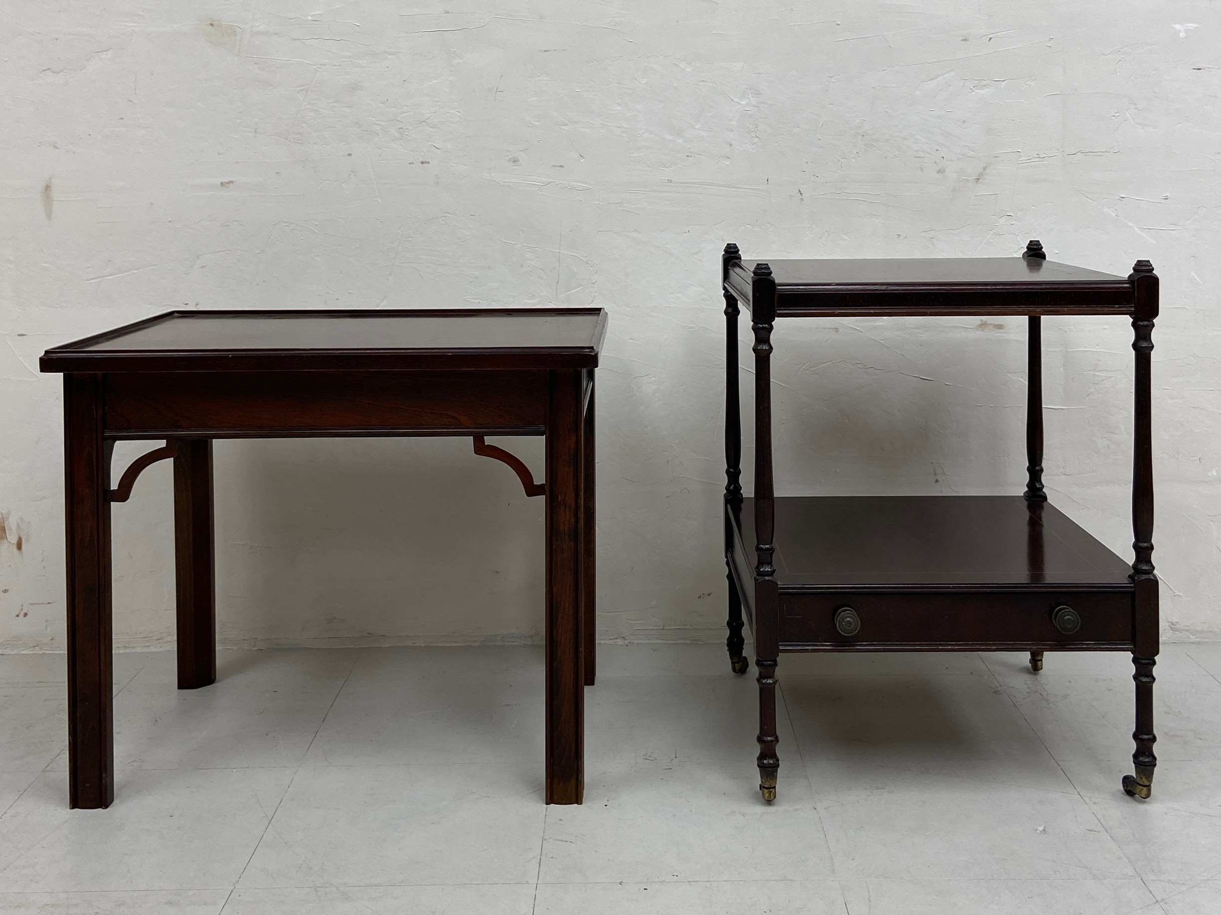 A Georgian style mahogany side table with a square top raised on straight supports with openwork