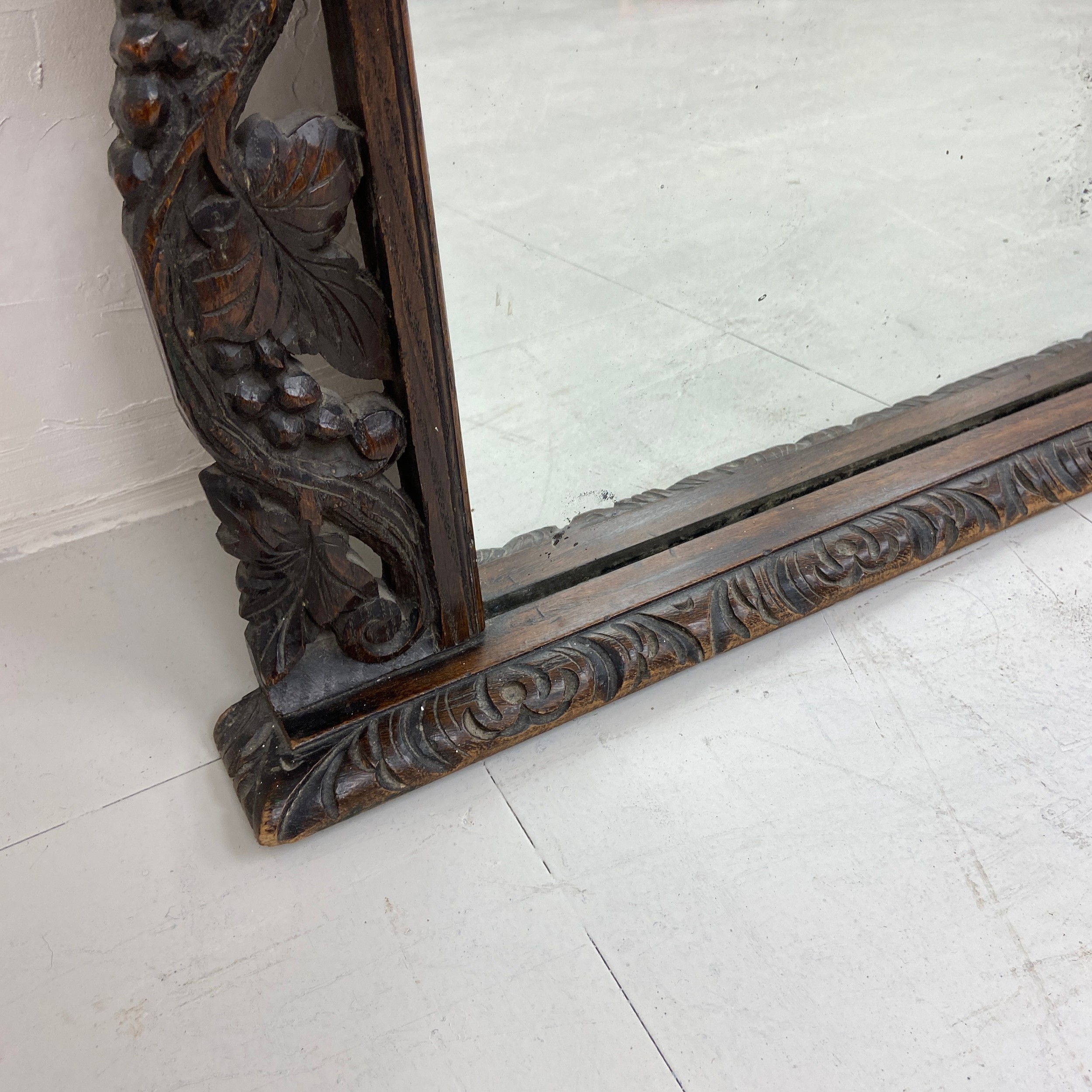 A large 19th century overmantle mirror having a rectangular plate in an ornately carved Baroque - Image 3 of 4