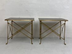 A pair of 20th century occasional tables each having a rectangular black marble top set into a