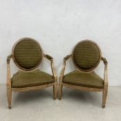 A pair of large contemporary Empire style armchairs with painted frames raised on tapering square