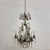 A Continental six branch chandelier with wrought metal frame and crystal drops. Dia.55cm Total