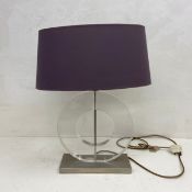A perspex Round Polo table lamp by Porta Romana. H.57cm