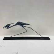 A contemporary metal bird sculpture by James Rivington Pyne, signed and dated '91 to the base.