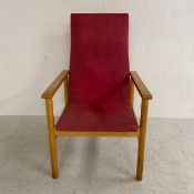 A mid century Parker Knoll beech framed armchair, Cornwell-Norton Model No. NT 1009, with label to