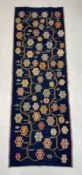 A Turkish style Kilim tapestry runner having a polychrome flowerhead and vine pattern over a