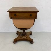 A 19th century mahogany work or sewing table having a rectangular top with a crossbanded edge and
