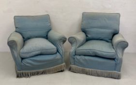 A matched pair to include a Victorian armchair with a square back and scrolled arms over a deep