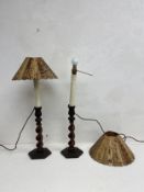 A pair of mid century carved oak barleytwist table lamps with bamboo shades. H.64cm