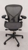 A contemporary ergonomic Aeron office chair with fully adjustable height, seat depth, tilt etc. by
