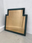 An Art Deco style peach glass wall mirror in coloured bevelled glazed frame. 90x89cm